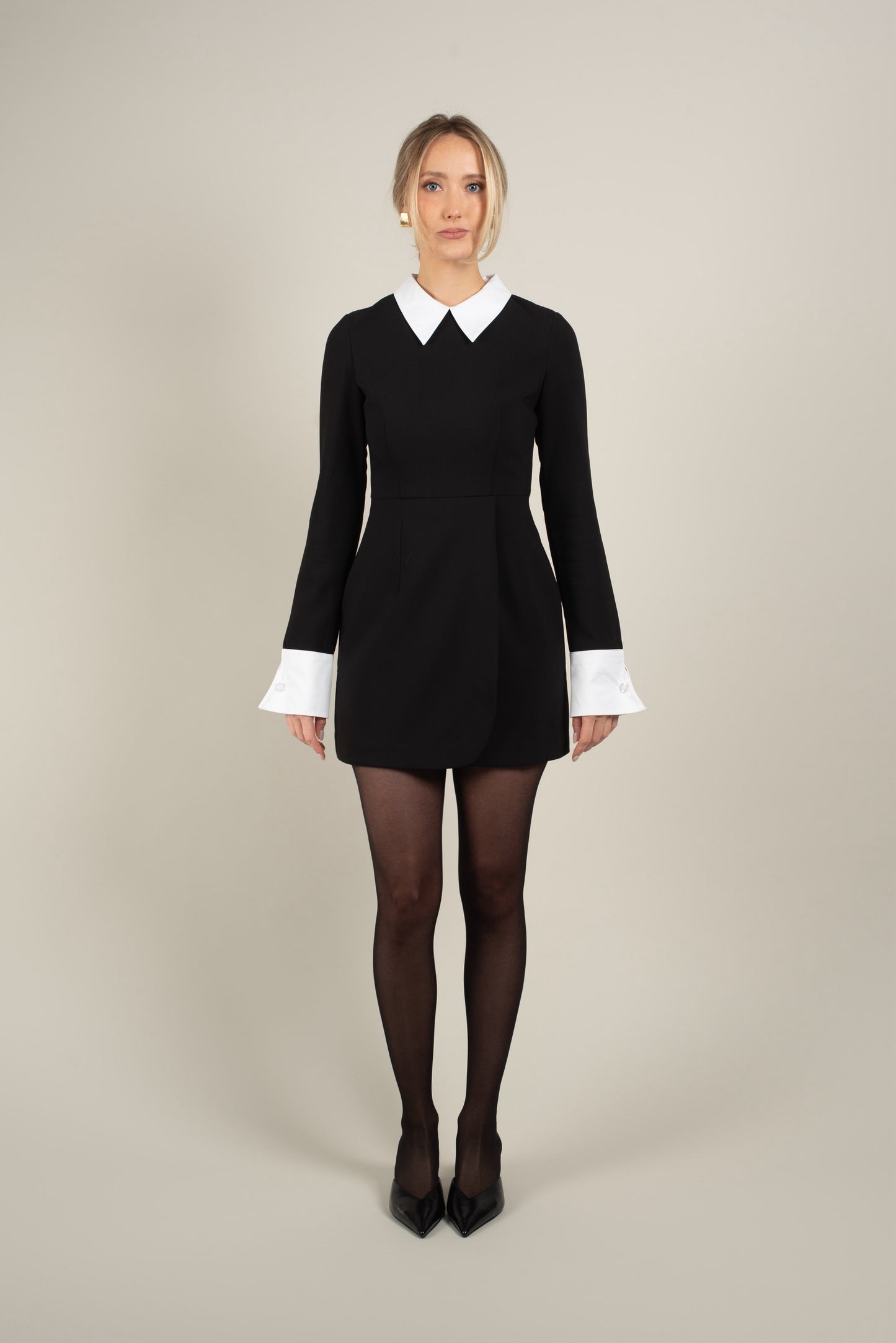 Black mini dress with white cuffs and collar